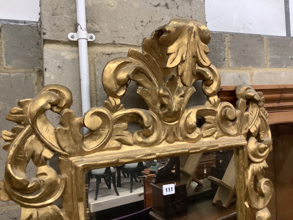 An 18th century style carved giltwood wall mirror, width 75cm height 110cm